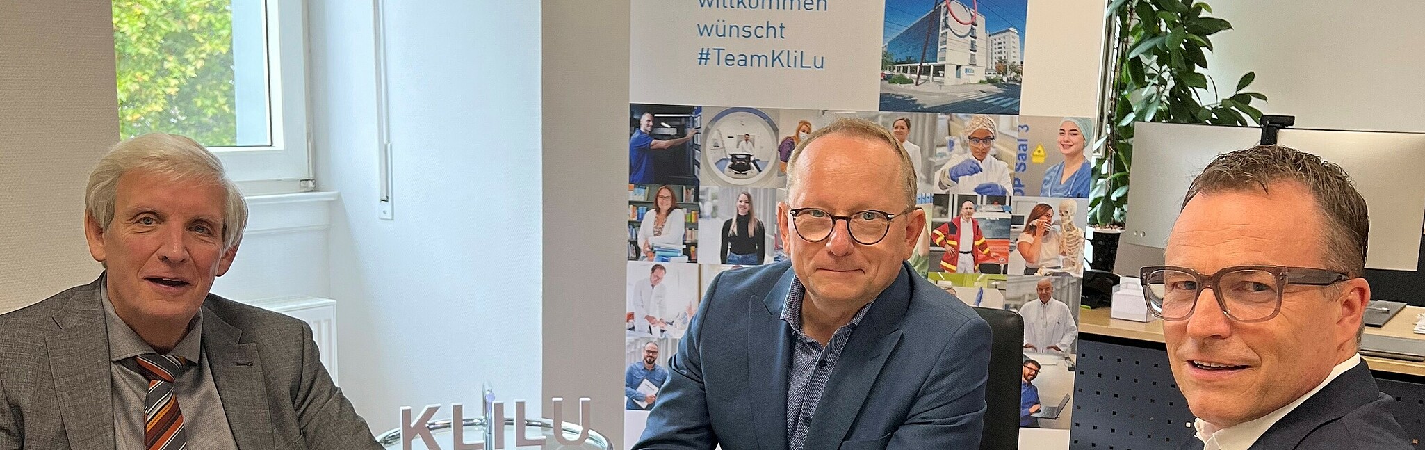 Frank Ratzlaff, Prof. Dr. Klaus Blettner und Jan Stanslowski sitzend an einem Tisch