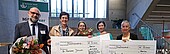 Two large checks will be presented to the two award winners.