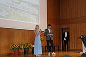 Graduates on the stage of the auditorium