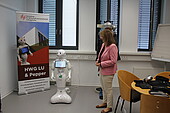 State Secretary Steingass laughs at Pepper the robot