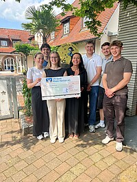 Students with donation check