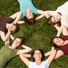 Students are lying on a meadow.