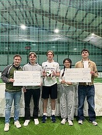 Students with a large donation check