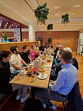 Board members of the association and students brainstorming together