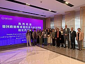 Group picture in front of the Sanda Univerity banner