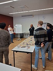 Group from behind in front of flipchart
