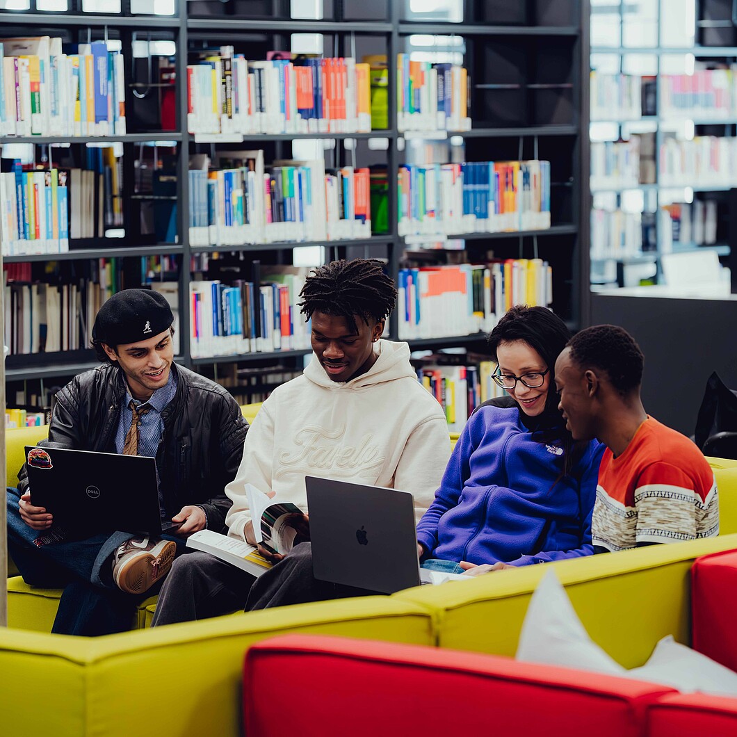 Group of students in the library seating area