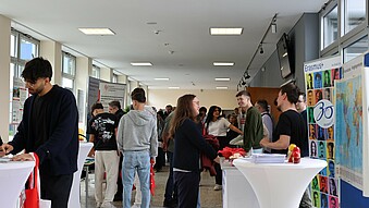 Well-attended advice stands in the foyer in front of the auditorium