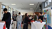 Well-attended advice stands in the foyer in front of the auditorium